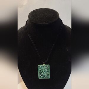 Jaguar Aztec Green Amulet pendant holding a Macahuitl Aztec Club